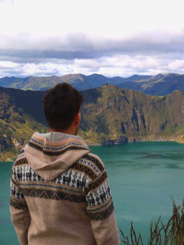 Person looking at mountain lake landscape